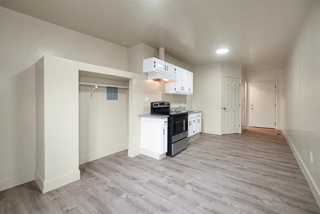 a view of kitchen with sink microwave and stove
