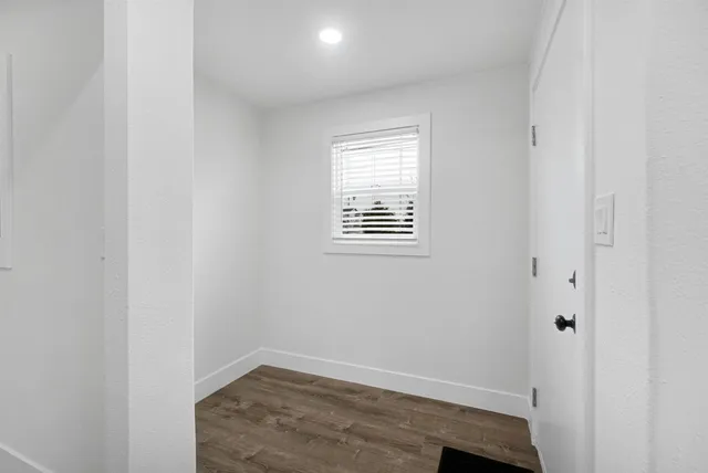 a view of an empty room with closet