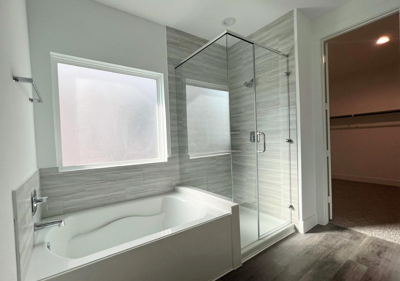 13725 Rising Sun Lane Conroe, TX 77384 - Photo 12 of 29 a bathroom with a bathtub and a shower