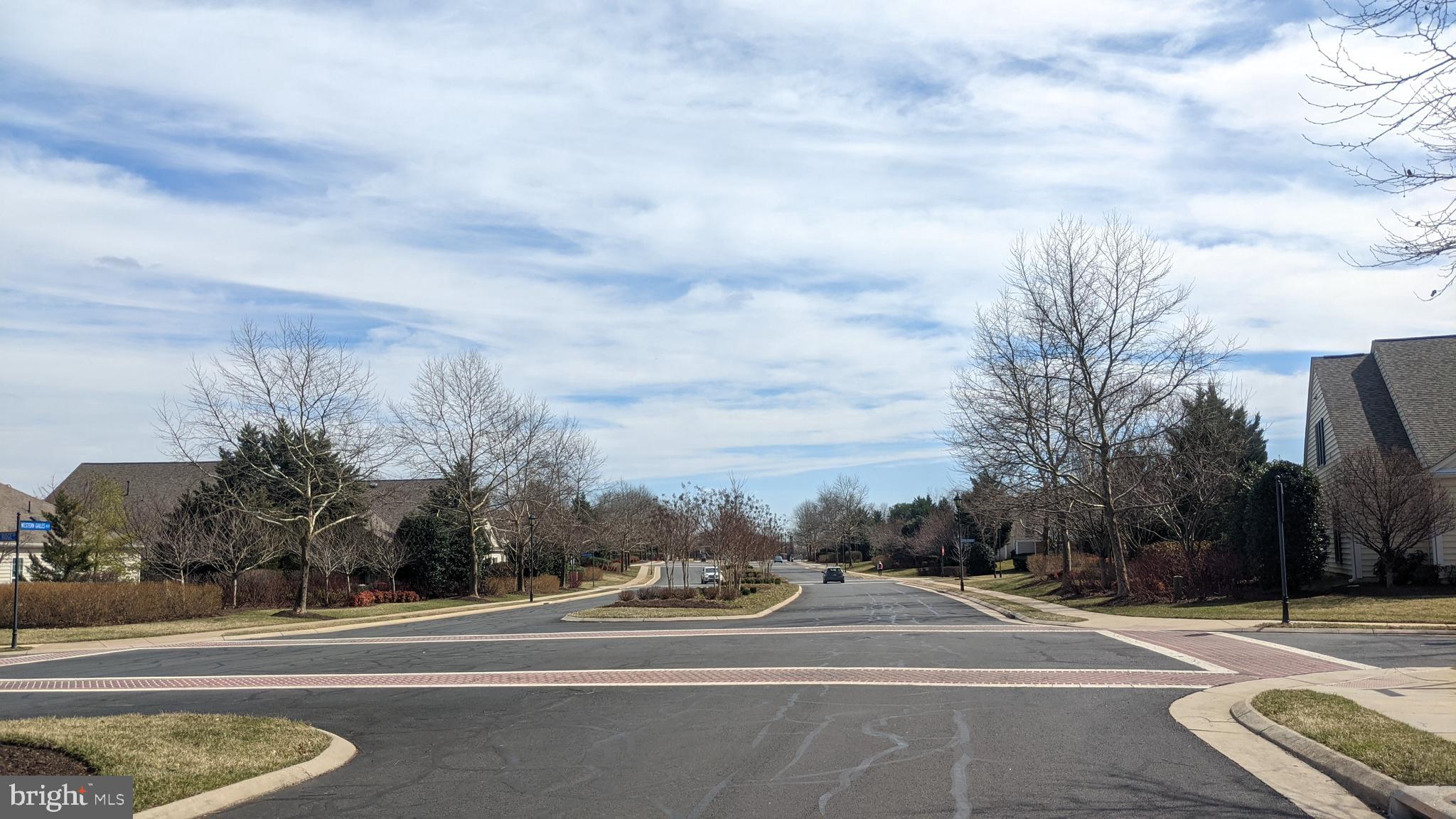 20620 Hope Spring Terrace, Unit 403 Ashburn, VA 20147 - Photo 13 of 43 Wide roads in the community