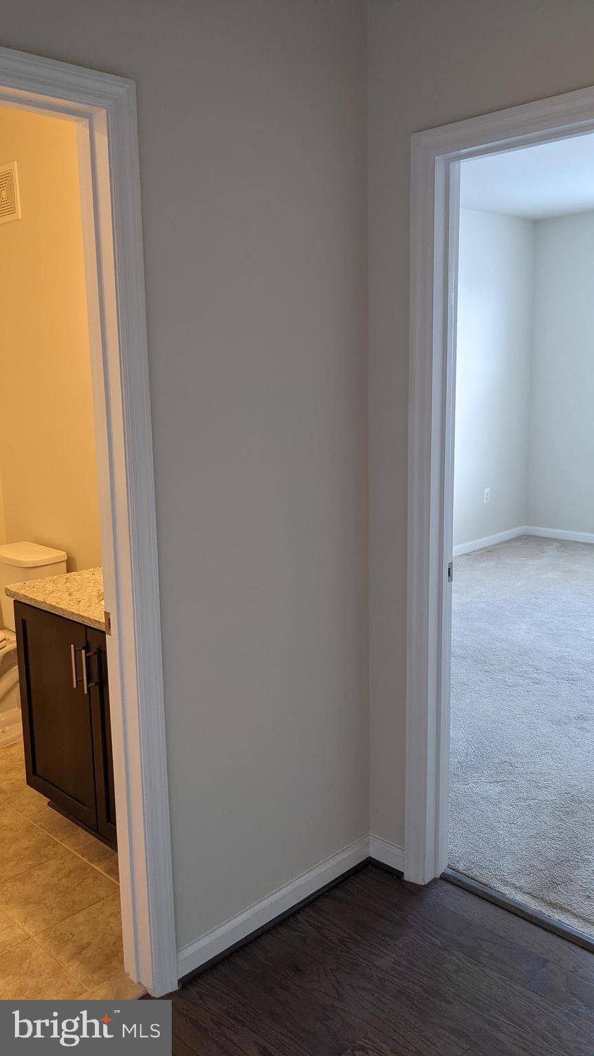 20620 Hope Spring Terrace, Unit 403 Ashburn, VA 20147 - Photo 27 of 43 Second bedroom hallway
