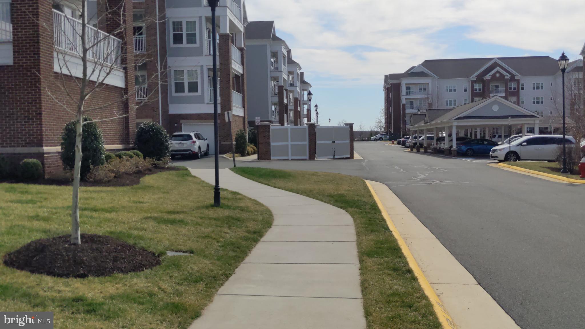 20620 Hope Spring Terrace, Unit 403 Ashburn, VA 20147 - Photo 3 of 43 Wide sidewalks around the community