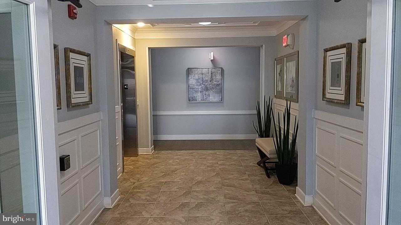 20620 Hope Spring Terrace, Unit 403 Ashburn, VA 20147 - Photo 7 of 43 Lobby of the building