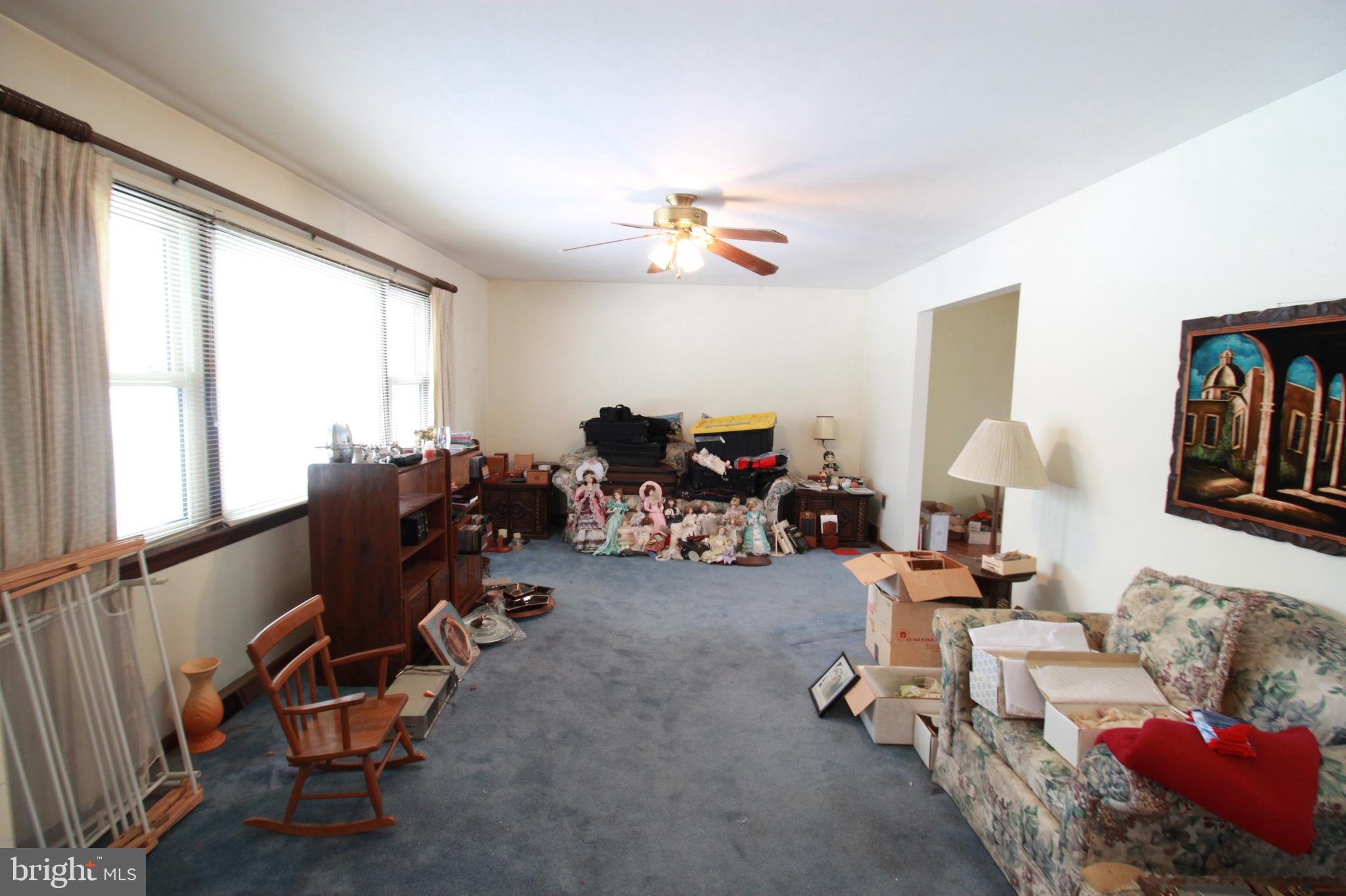 34 Applegate Road Jobstown, NJ 08041 - Photo 4 of 29 a living room with furniture gym equipment and a large window