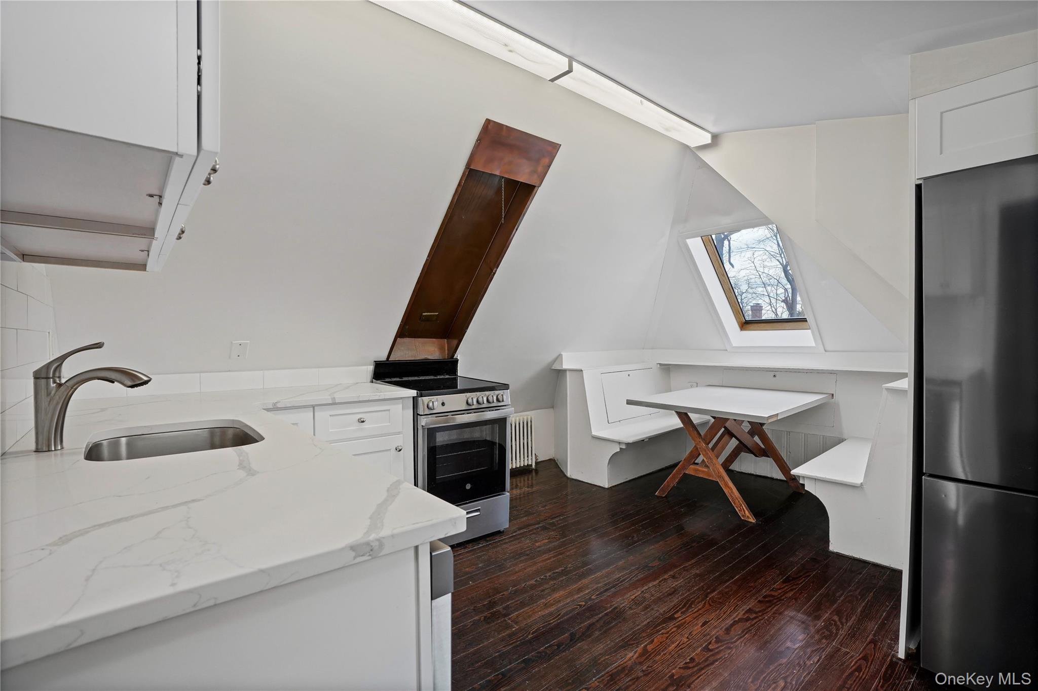 9 Ridgeview Avenue White Plains, NY 10606 - Photo 15 of 20 a kitchen with a sink a stove and a wooden floor
