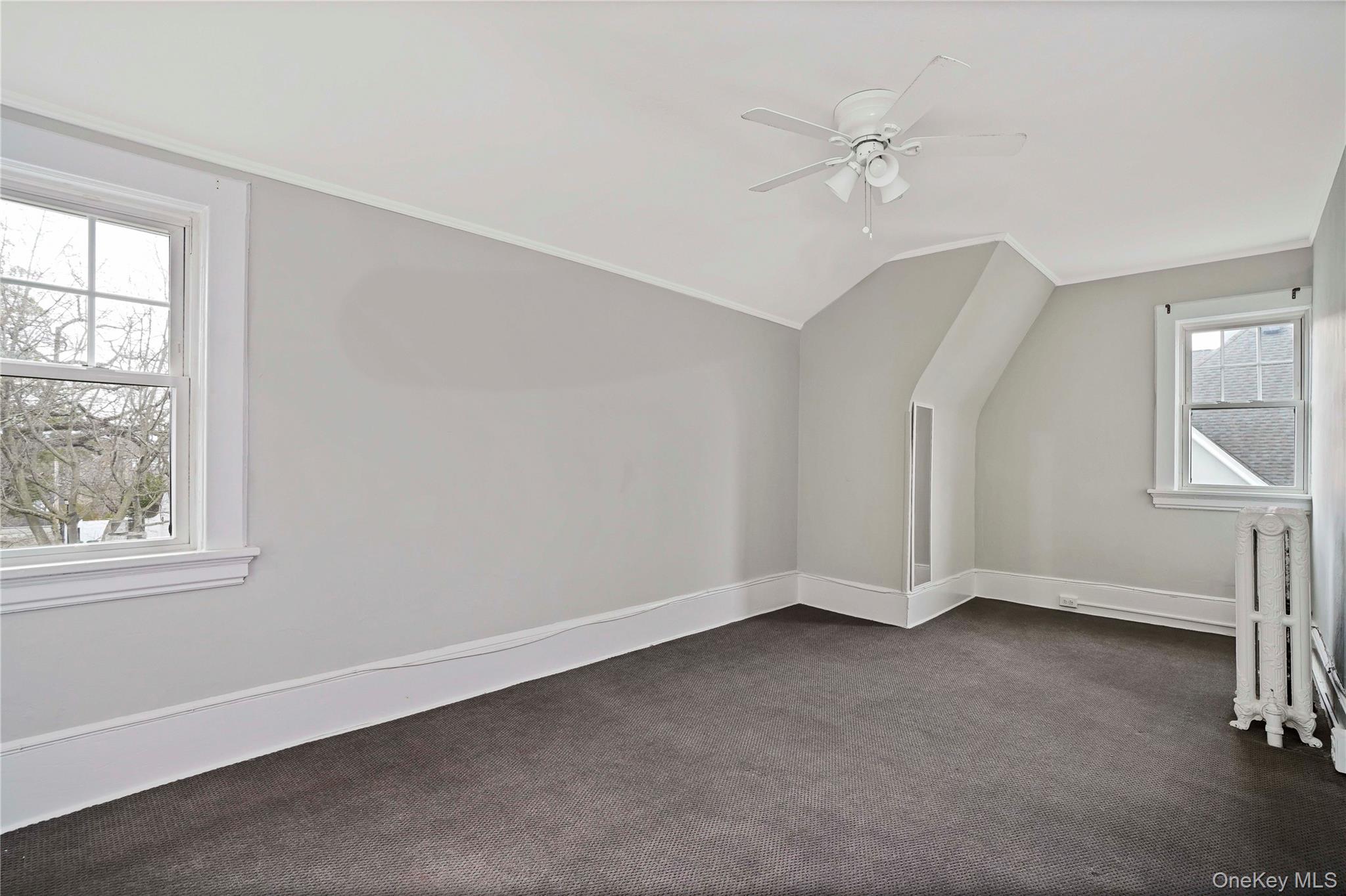 9 Ridgeview Avenue White Plains, NY 10606 - Photo 6 of 20 an empty room with a window and a ceiling fan