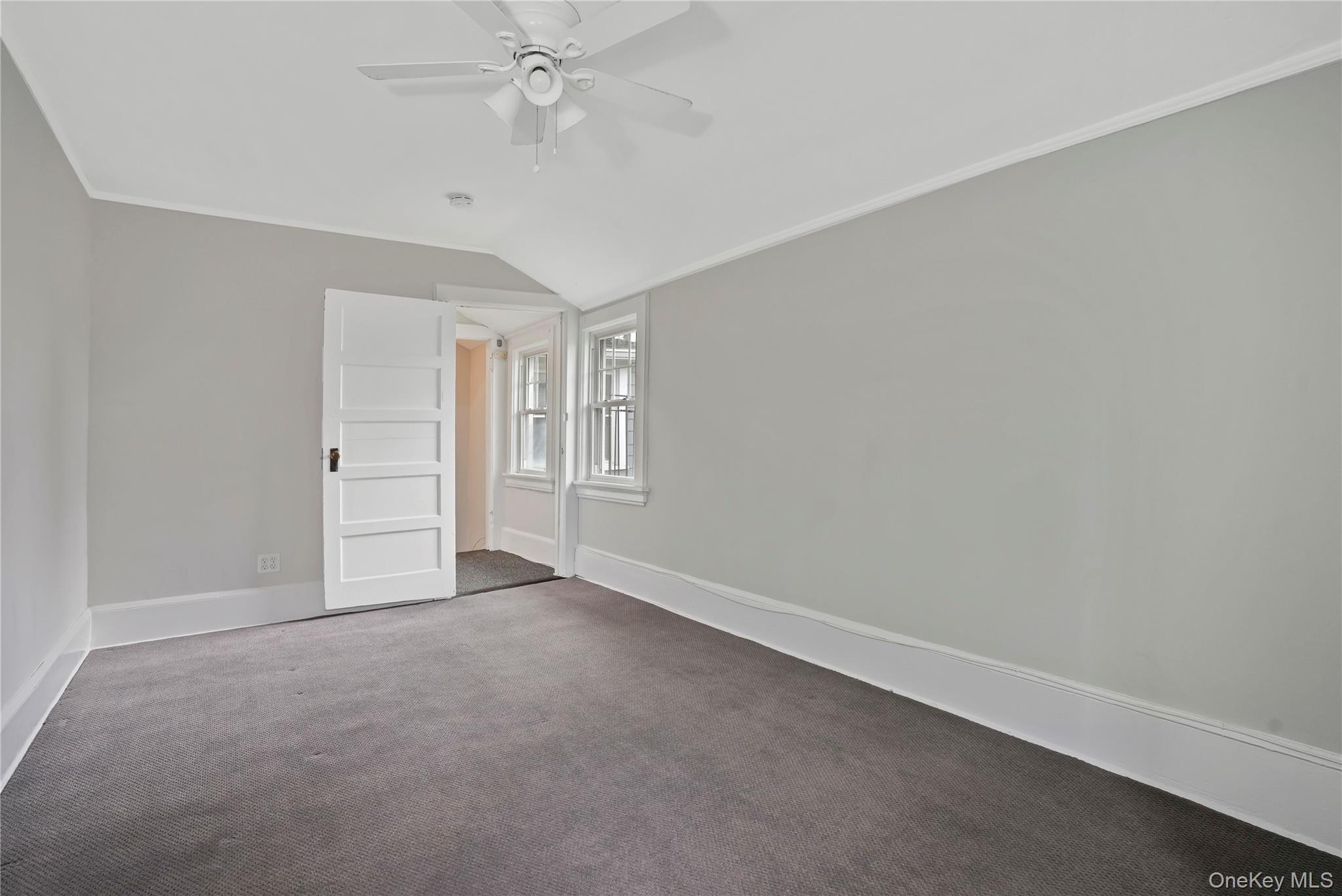9 Ridgeview Avenue White Plains, NY 10606 - Photo 7 of 20 an empty room with chandelier fan and windows