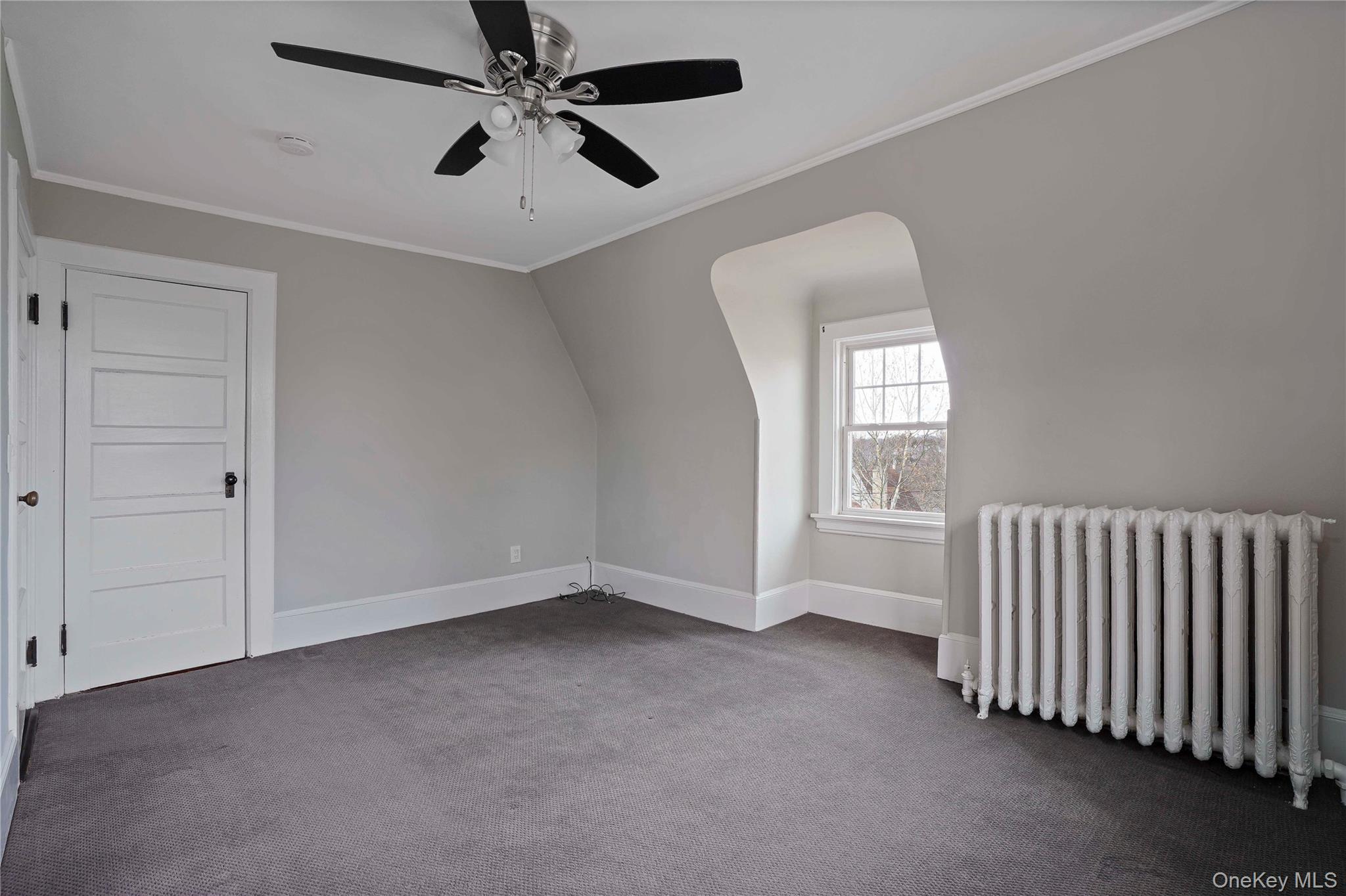 9 Ridgeview Avenue White Plains, NY 10606 - Photo 9 of 20 an empty room with windows and fan