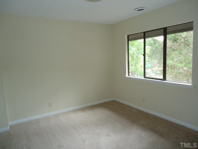 3060 Colony Road, Unit C Durham, NC 27705 - Photo 9 of 15 an empty room with a window