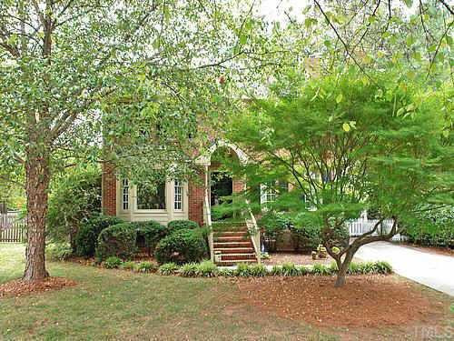 405 Maylands Avenue Raleigh, NC 27615 - Photo 1 of 10 Truly gorgeous home with brick front, long brick stairway w/ wooden handrails, newly painted black door, Williamsburg arch-covered entry, long set back from street in cul-de-sac. Great North Raleigh location close to everything!! Exterior Front