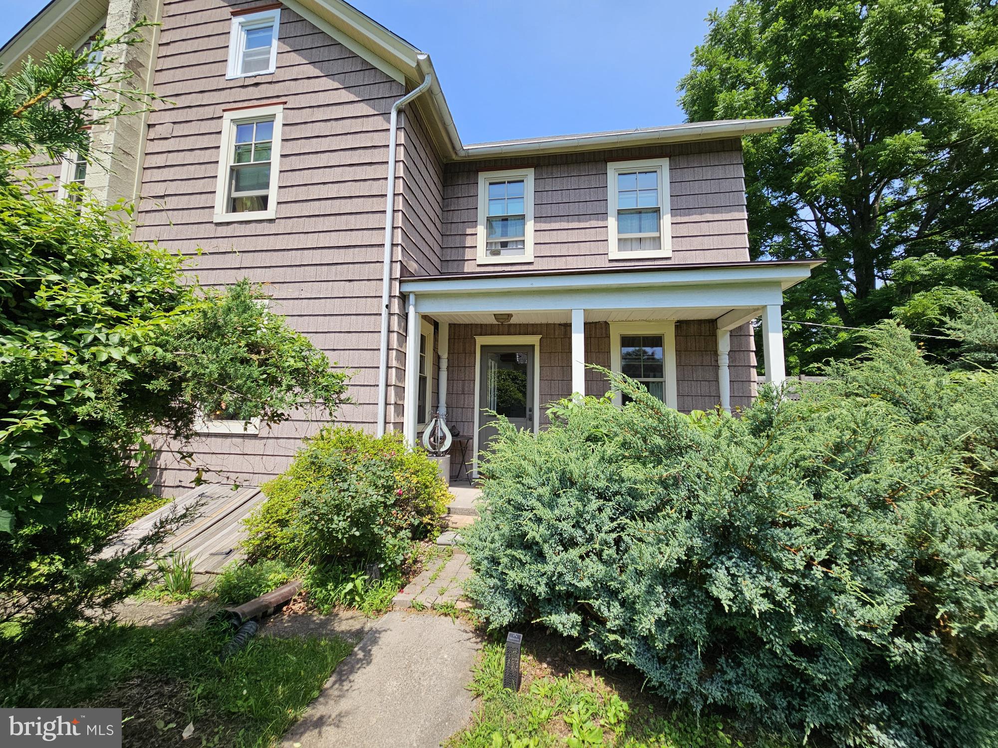 9039 Easton Road Ottsville, PA 18942 - Photo 46 of 61 a view of a house with a yard and potted plants