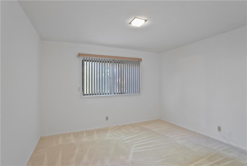 20 26th Street Northwest, Unit B1 Atlanta, GA 30309 - Photo 12 of 21 a view of an empty room with window