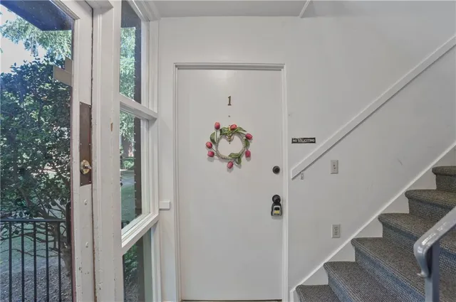 a view of entryway with wooden floor