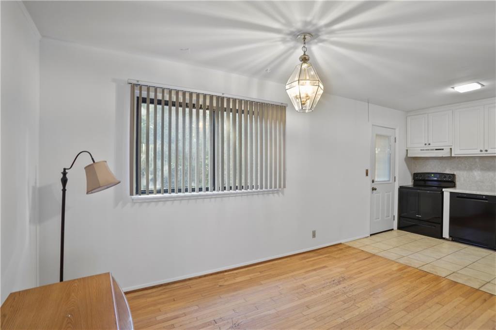 20 26th Street Northwest, Unit B1 Atlanta, GA 30309 - Photo 9 of 21 a view of a kitchen with an empty space and a window