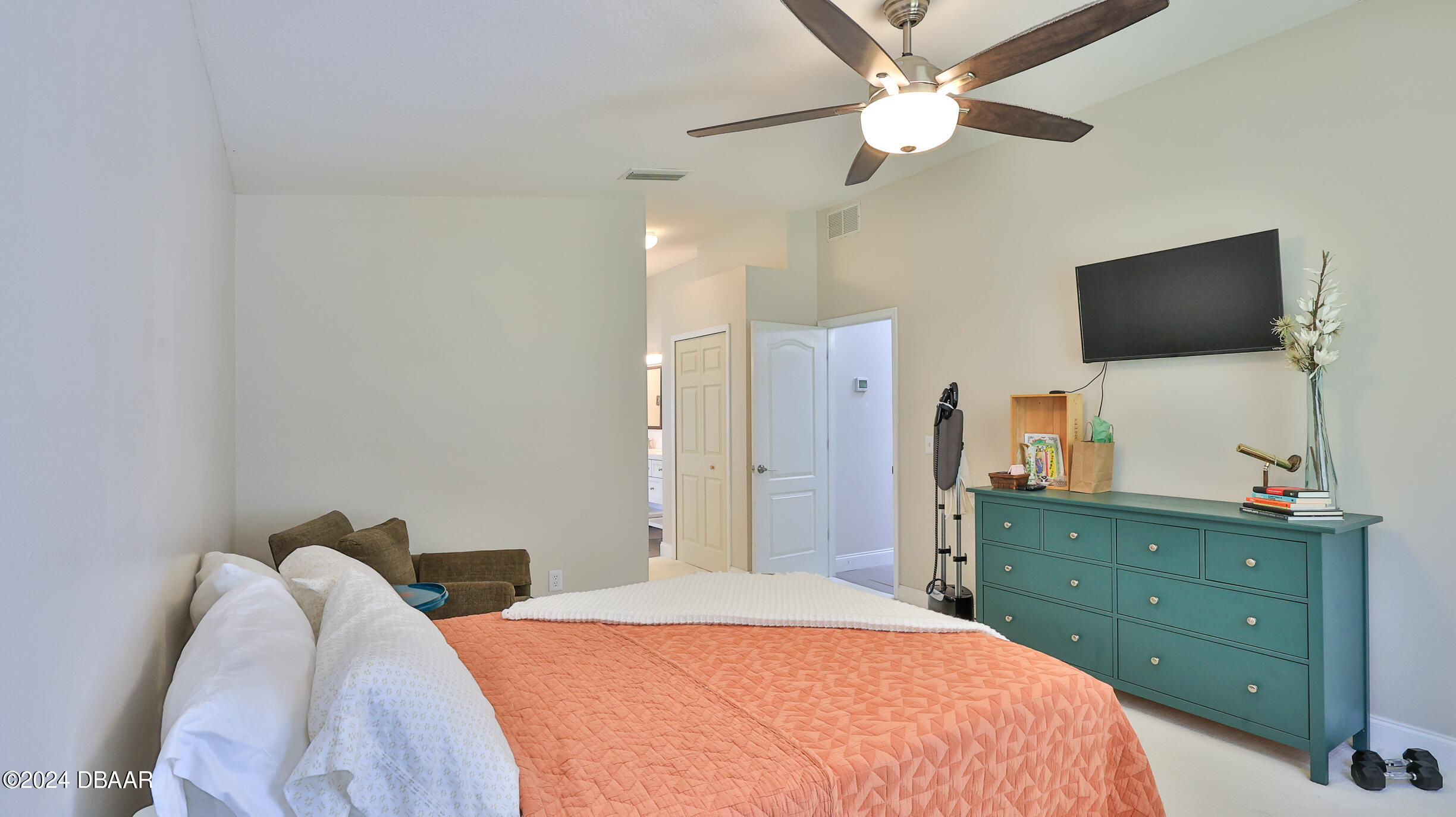 16 Meadow Ridge View Ormond Beach, FL 32174 - Photo 25 of 45 a bedroom with a bed and a flat screen tv