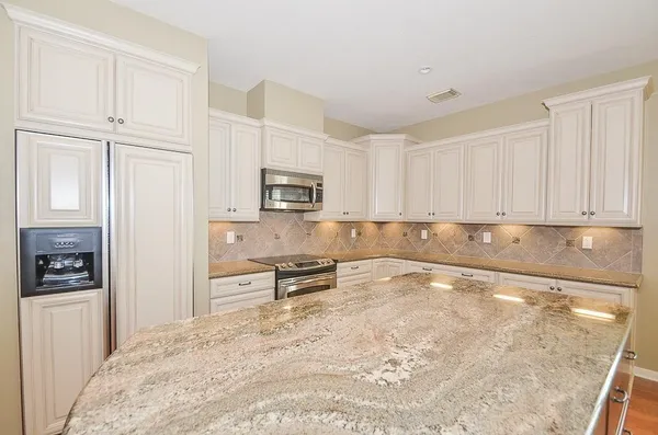 a view of a kitchen with electric appliances