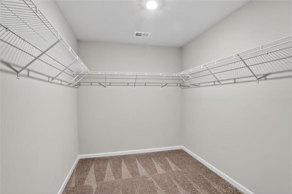 1553 Spring Hollow Way Stone Mountain, GA 30083 - Photo 15 of 27 a view of a room with racks on the wall