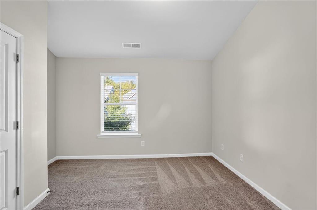 1553 Spring Hollow Way Stone Mountain, GA 30083 - Photo 18 of 27 a view of a window in an empty room