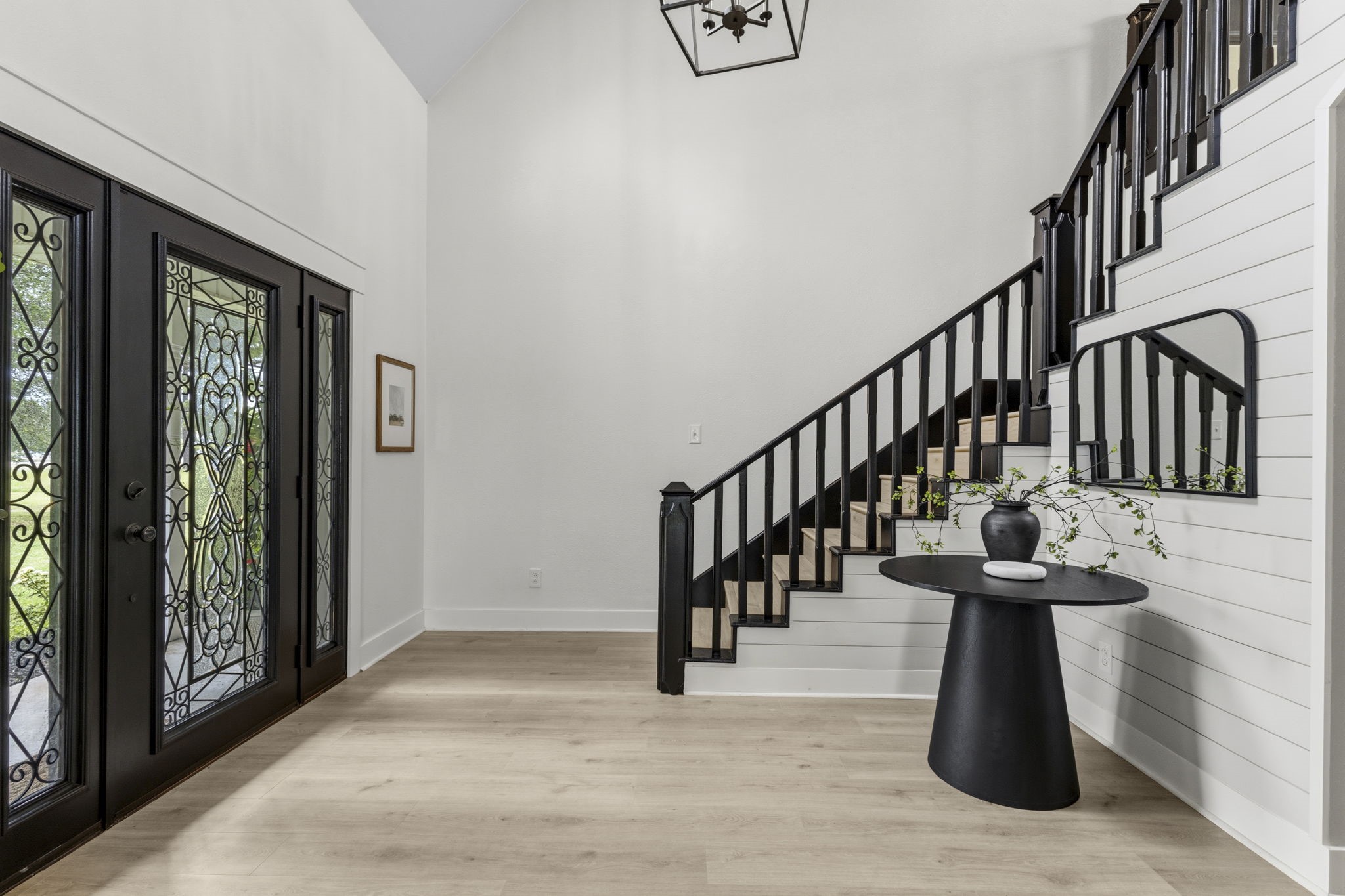 16421 Westbury Road Beaumont, TX 77713 - Photo 6 of 29 a hallway with wooden floor and windows