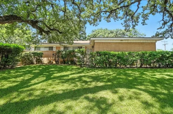 a view of house with backyard outdoor seating and lake