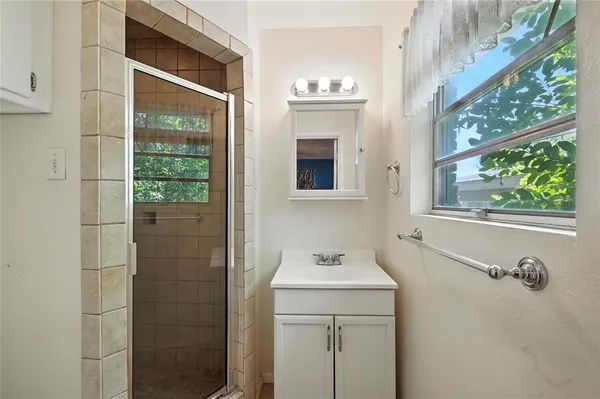 a bathroom with a sink a toilet and a shower