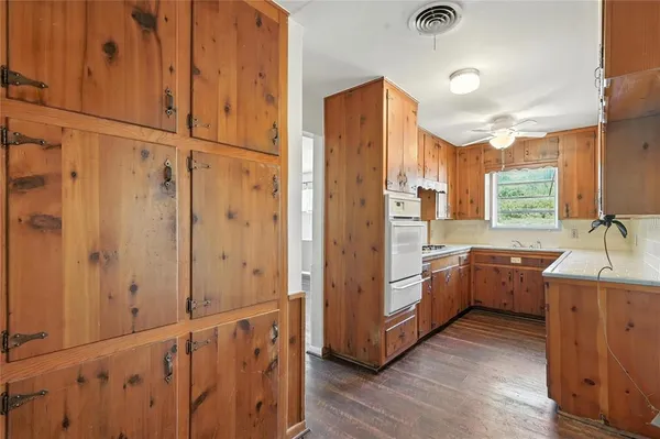 a kitchen with stainless steel appliances a sink and cabinets