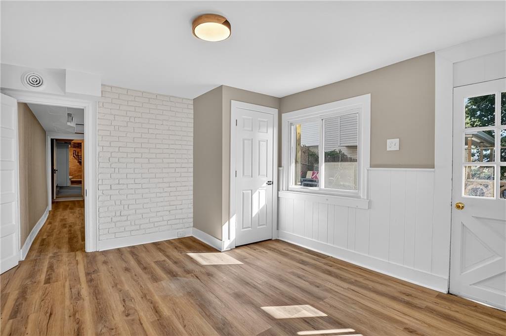 2636 Cobden Street Pittsburgh, PA 15203 - Photo 21 of 28 an empty room with wooden floor and windows