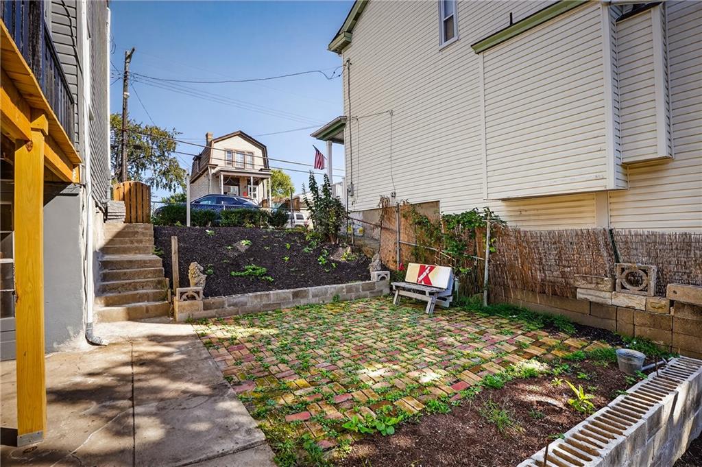 2636 Cobden Street Pittsburgh, PA 15203 - Photo 24 of 28 a view of a chairs and table in backyard of the house