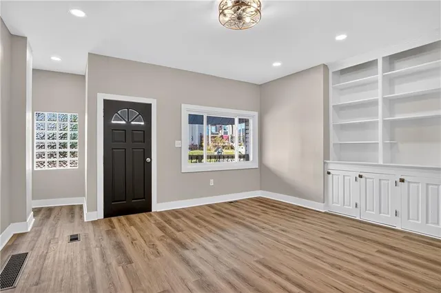 a view of an empty room with a window