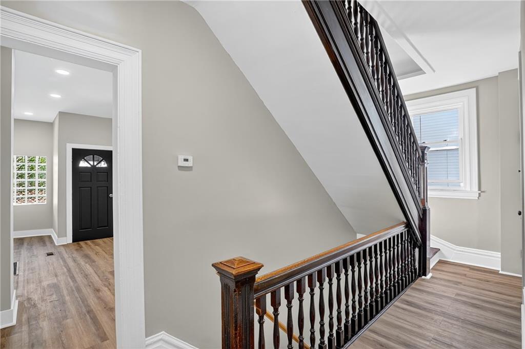 2636 Cobden Street Pittsburgh, PA 15203 - Photo 5 of 28 a view of a hallway with wooden floor and stairs