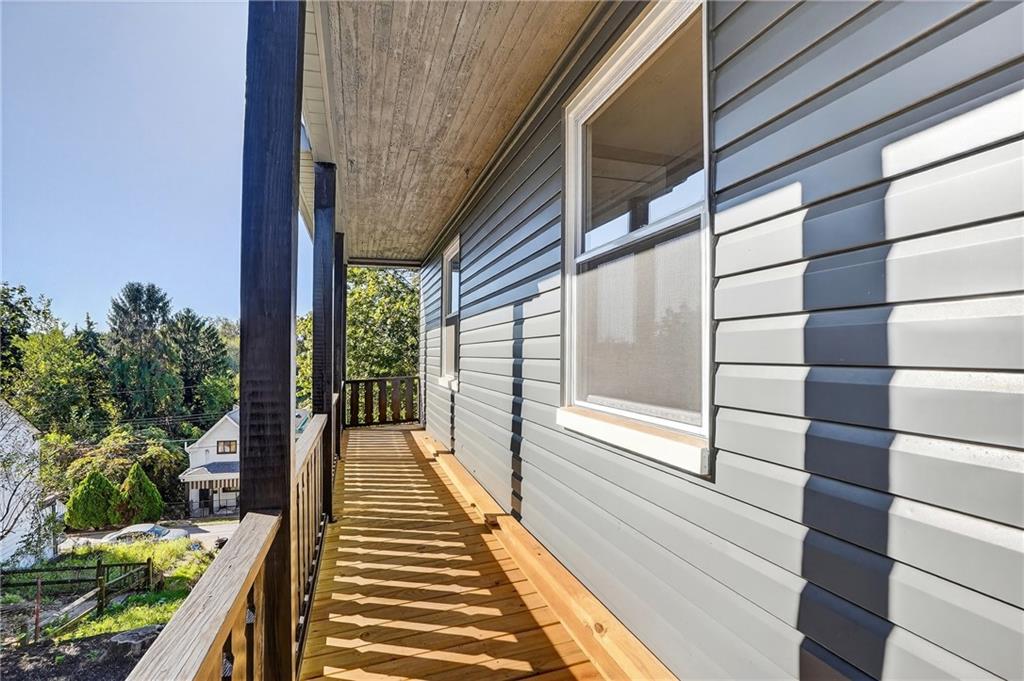 2636 Cobden Street Pittsburgh, PA 15203 - Photo 10 of 28 a view of a balcony with wooden floor and potted plants
