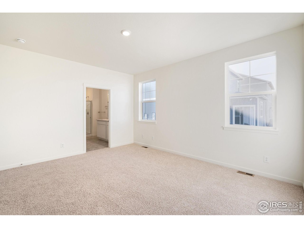 944 London Way Severance, CO 80550 - Photo 19 of 27 a view of an empty room with a window