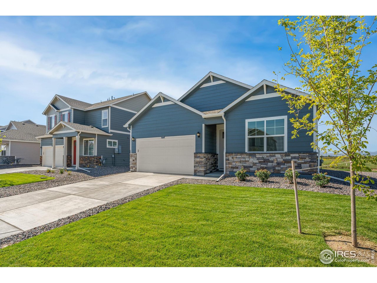944 London Way Severance, CO 80550 - Photo 2 of 27 a front view of a house with garden