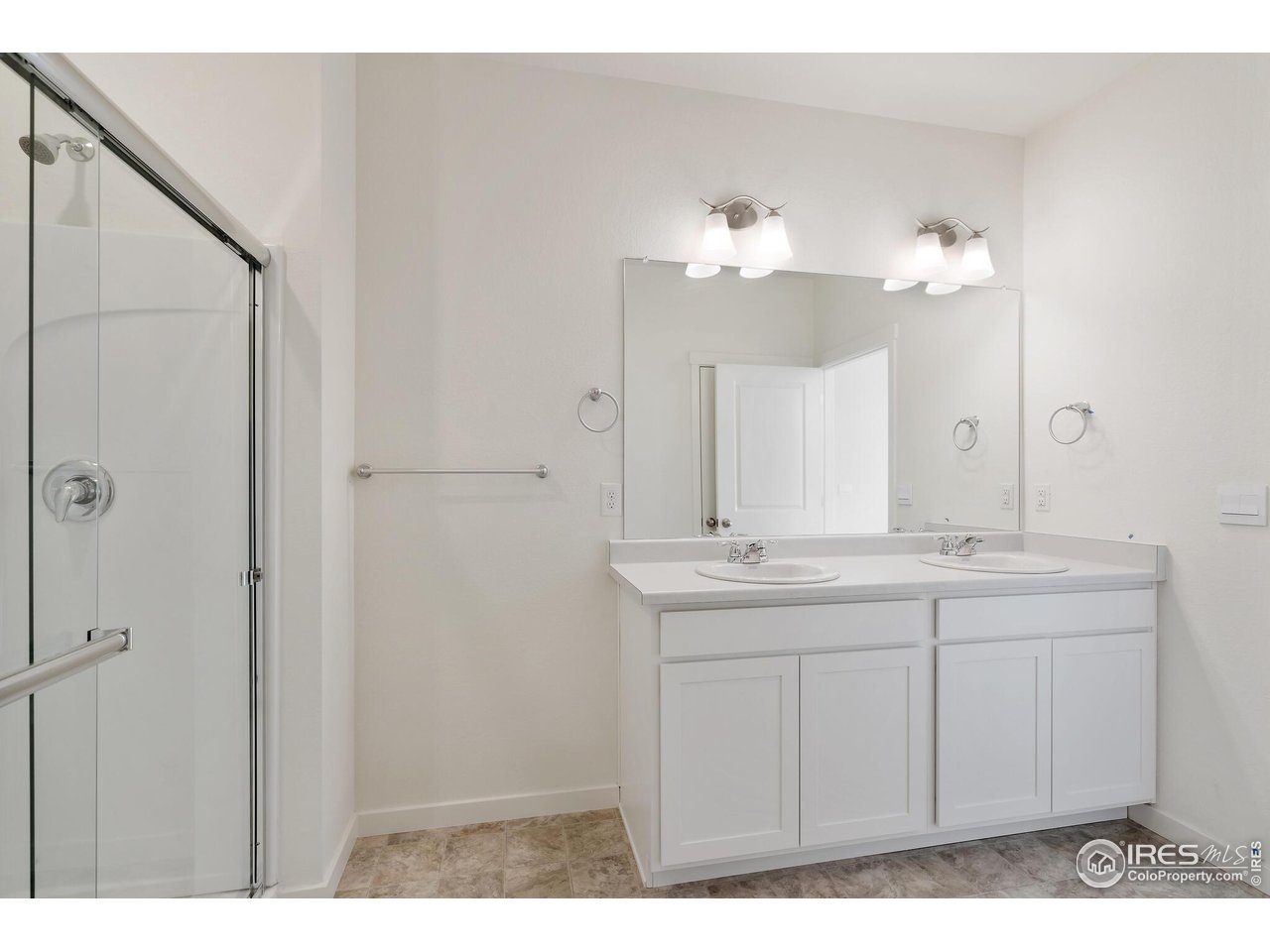 944 London Way Severance, CO 80550 - Photo 21 of 27 a bathroom with a sink and a mirror