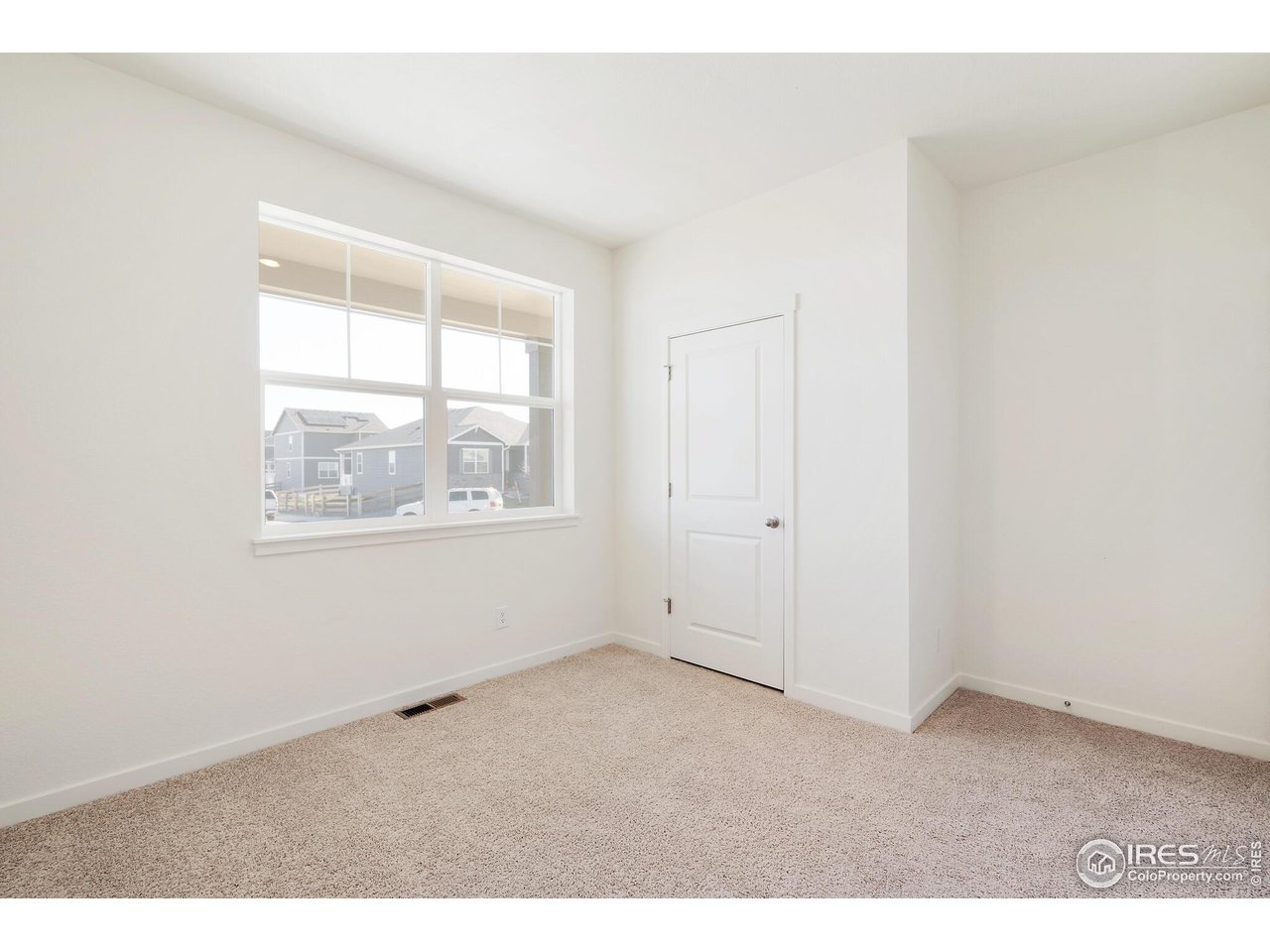 944 London Way Severance, CO 80550 - Photo 23 of 27 an empty room with windows