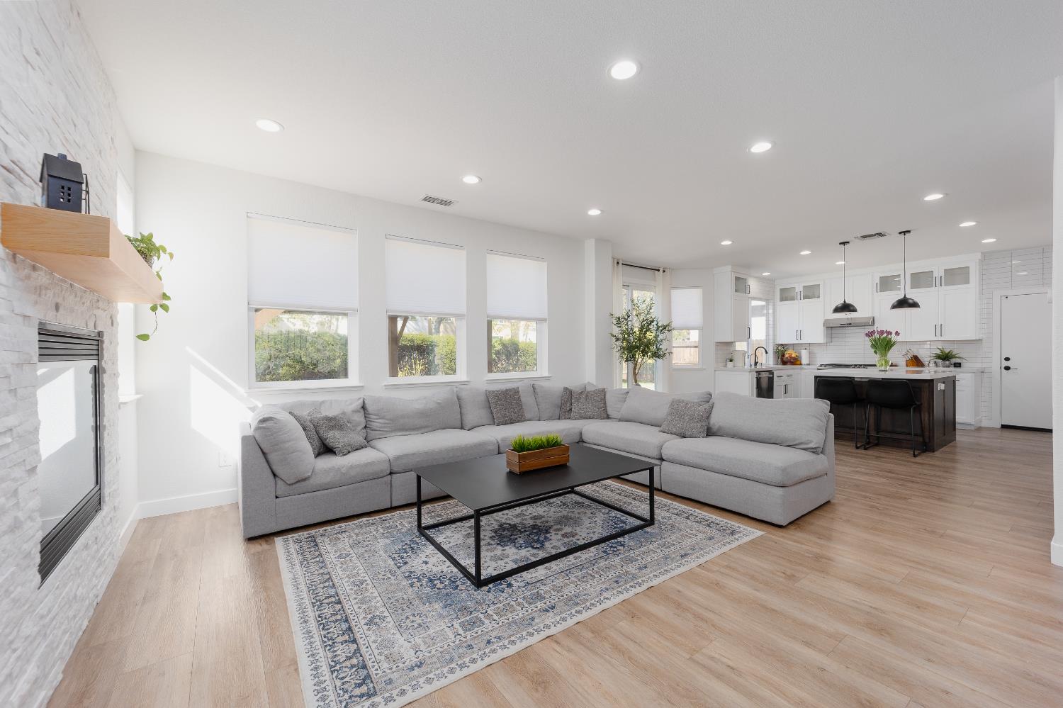 10969 Pelara Way Rancho Cordova, CA 95670 - Photo 13 of 39 a living room with furniture and kitchen view
