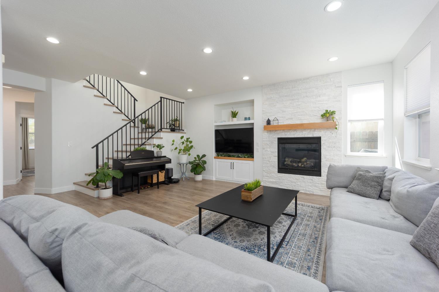 10969 Pelara Way Rancho Cordova, CA 95670 - Photo 15 of 39 a living room with furniture and a fireplace