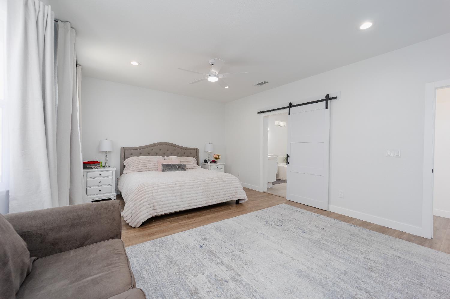 10969 Pelara Way Rancho Cordova, CA 95670 - Photo 20 of 39 a bedroom with a bed and a couch