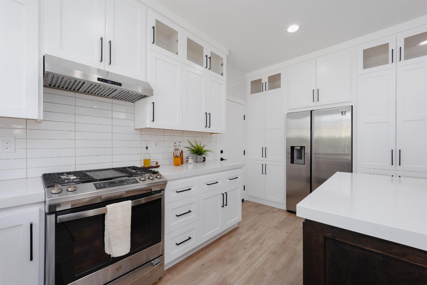 10969 Pelara Way Rancho Cordova, CA 95670 - Photo 2 of 39 a kitchen with stainless steel appliances a stove microwave and a refrigerator