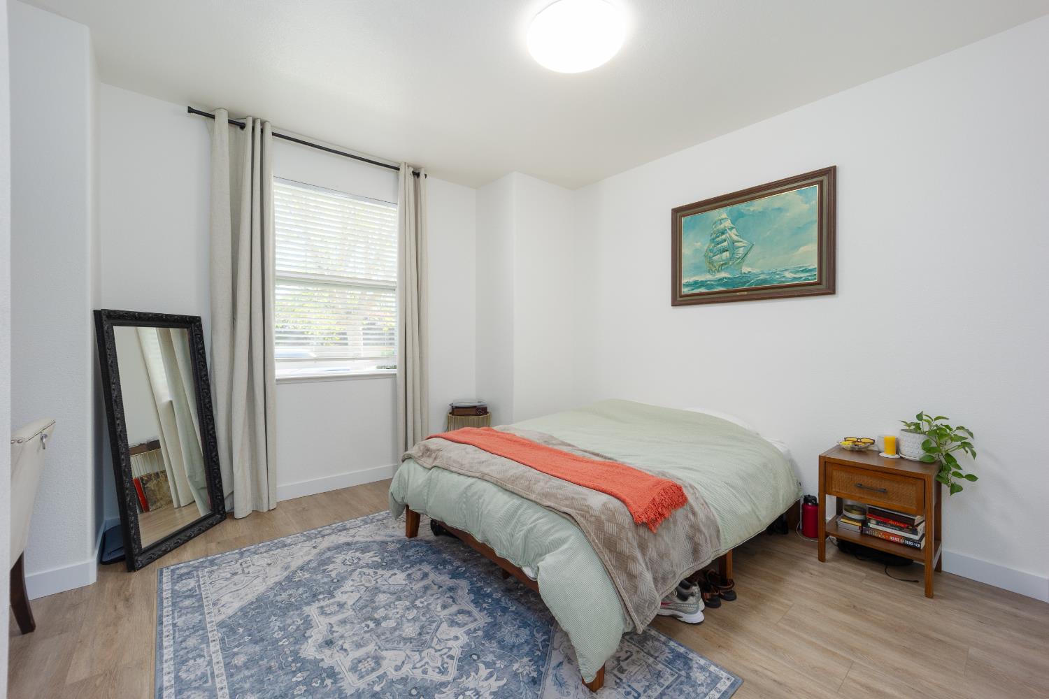 10969 Pelara Way Rancho Cordova, CA 95670 - Photo 24 of 39 a bedroom with a bed and a window