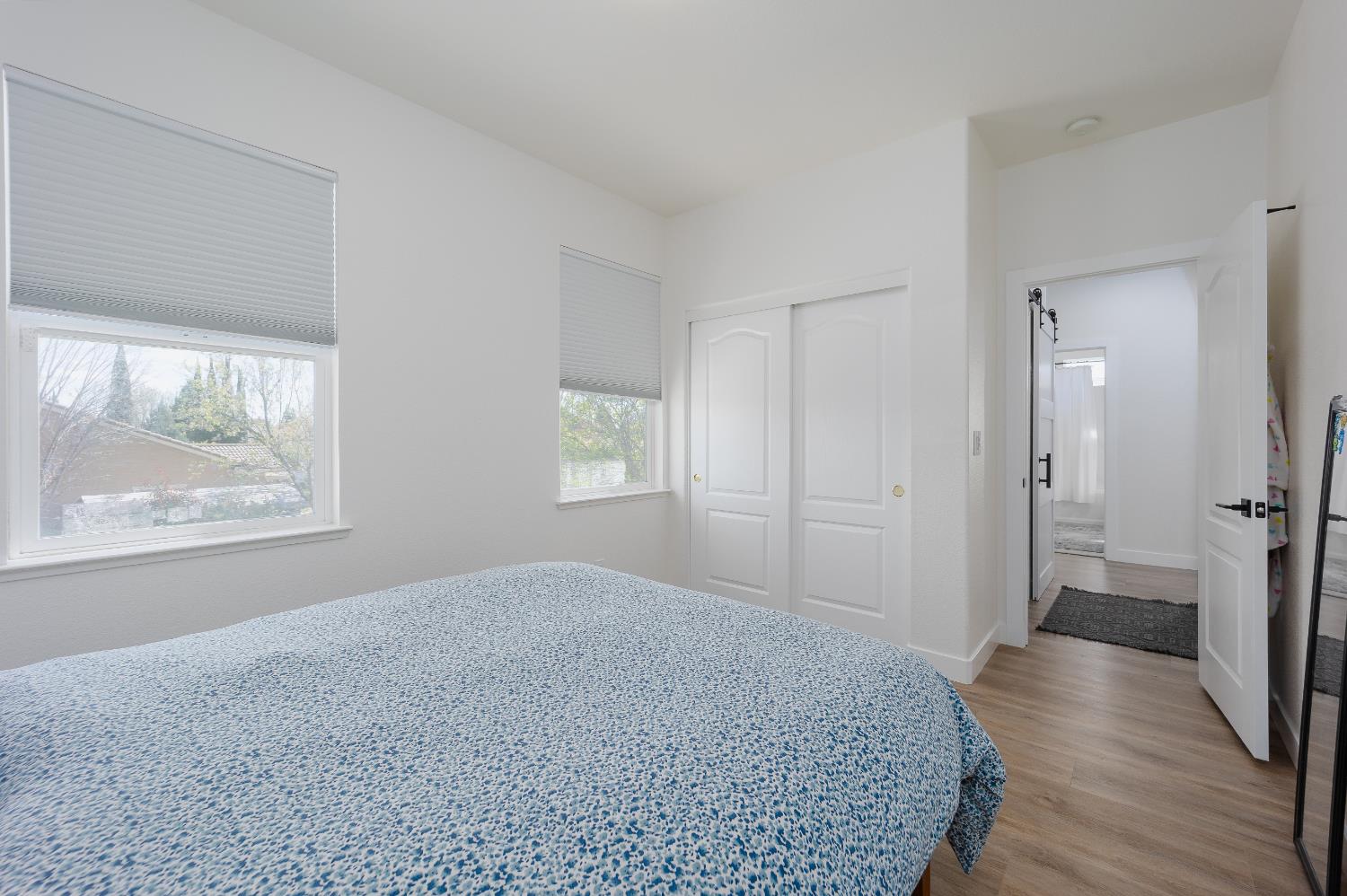 10969 Pelara Way Rancho Cordova, CA 95670 - Photo 26 of 39 an empty room with wooden floor and windows