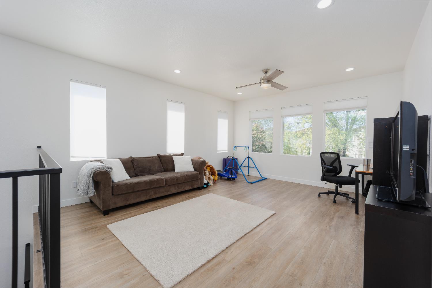 10969 Pelara Way Rancho Cordova, CA 95670 - Photo 29 of 39 a living room with furniture a large window and wooden floor