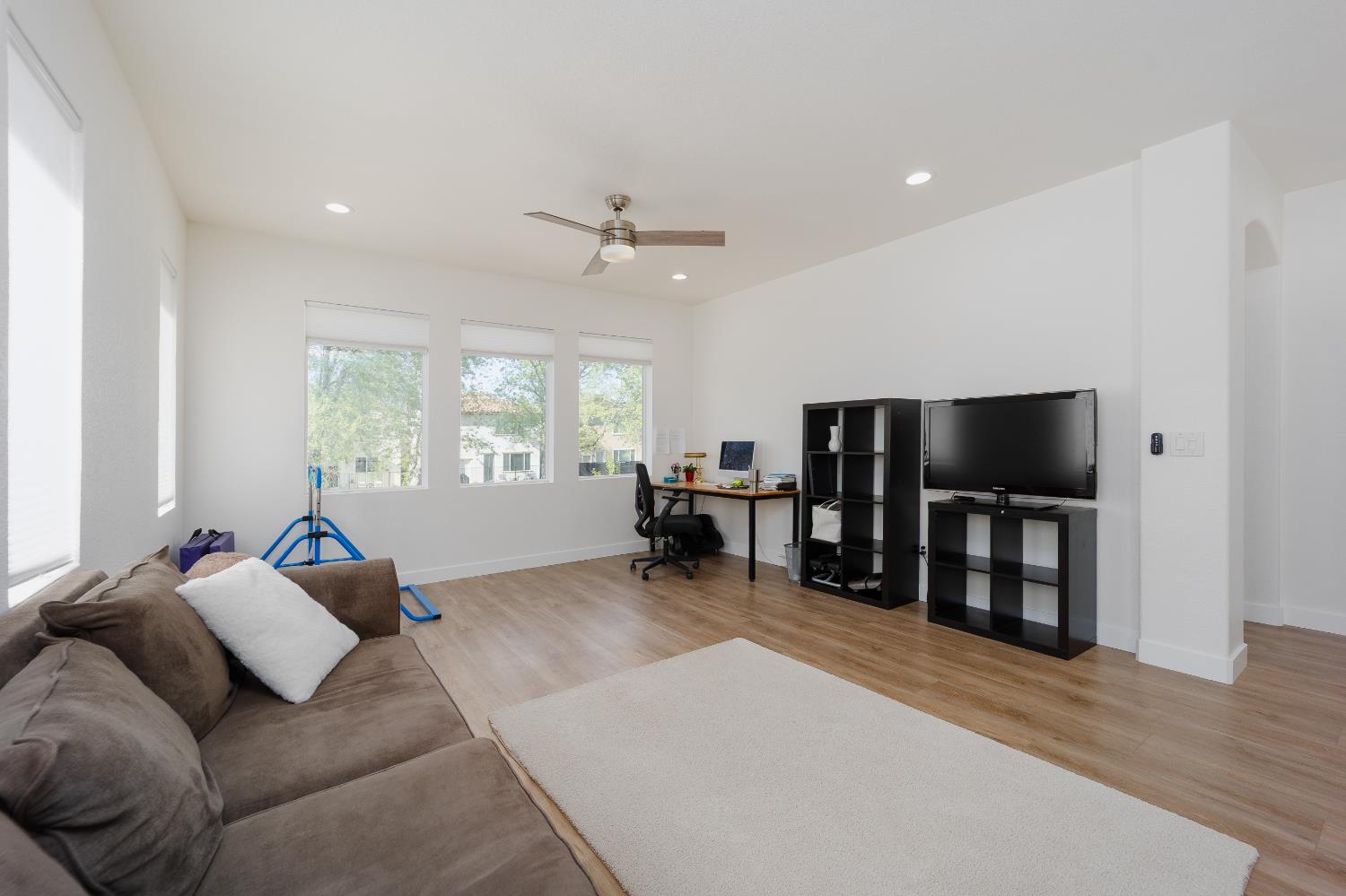10969 Pelara Way Rancho Cordova, CA 95670 - Photo 30 of 39 a living room with furniture and a flat screen tv