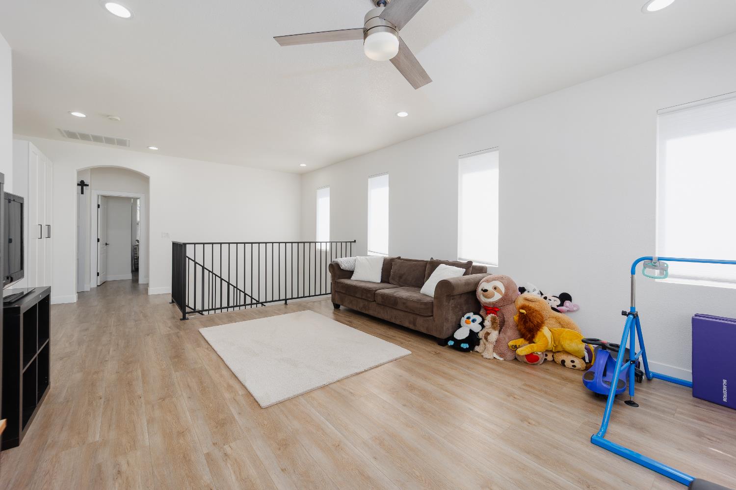 10969 Pelara Way Rancho Cordova, CA 95670 - Photo 32 of 39 a bed room with furniture and a wooden floor