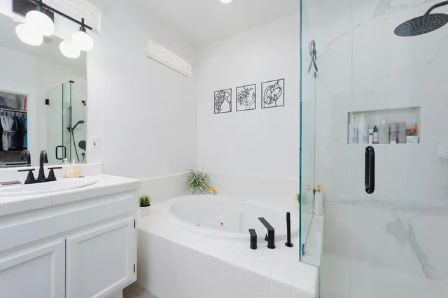 a bathroom with a sink a toilet and a bathtub