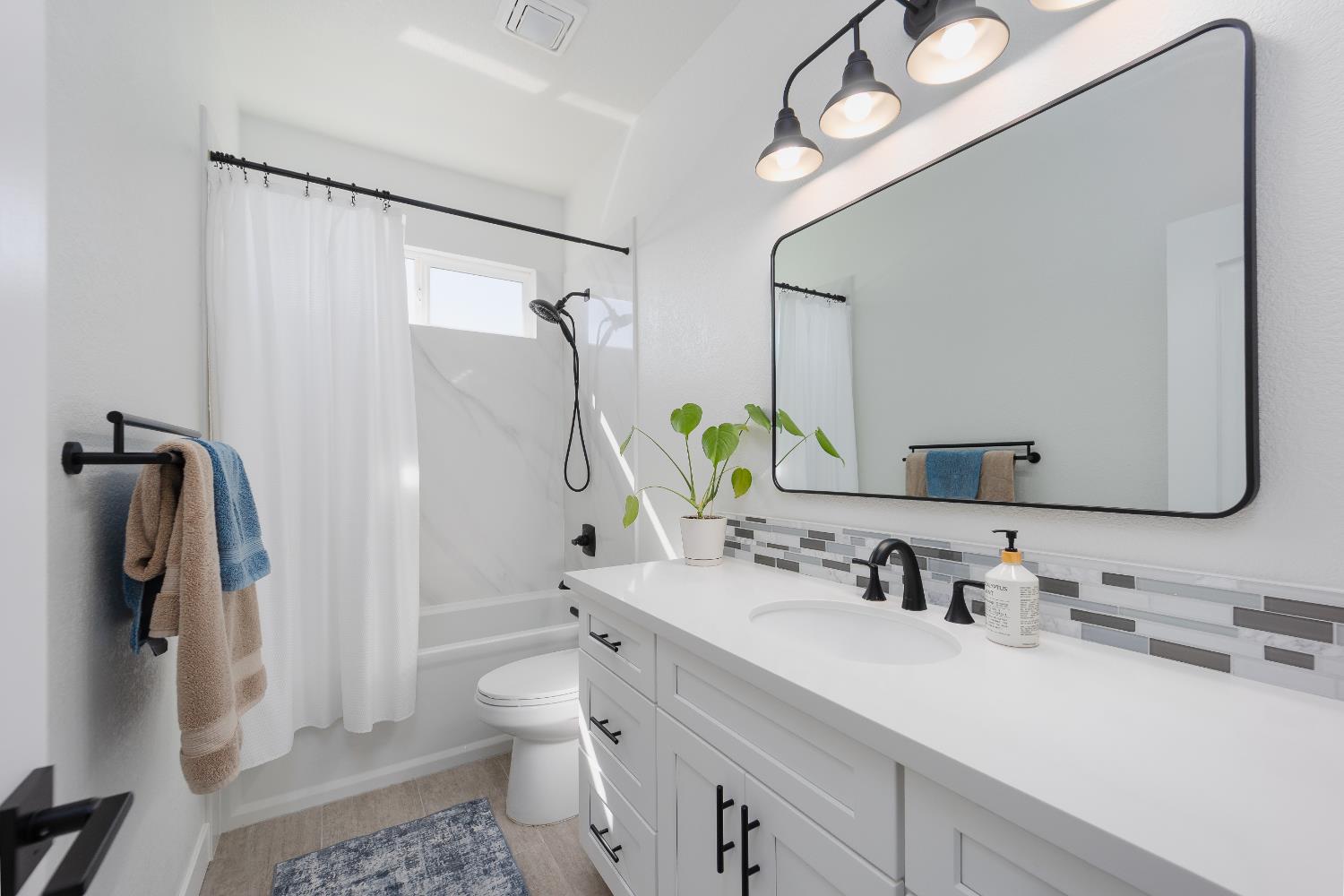 10969 Pelara Way Rancho Cordova, CA 95670 - Photo 34 of 39 a bathroom with a sink vanity granite toilet and shower