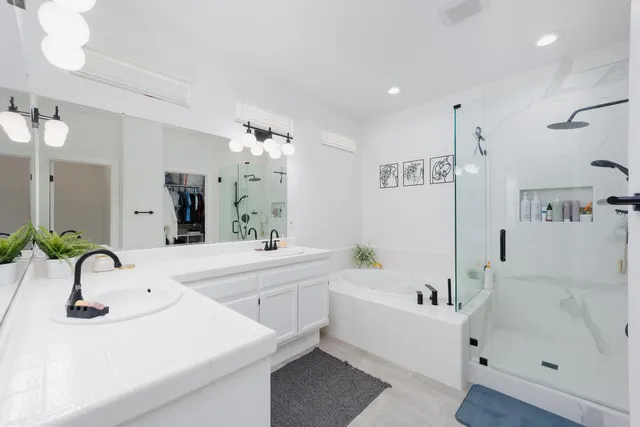 a bathroom with a bathtub and a sink