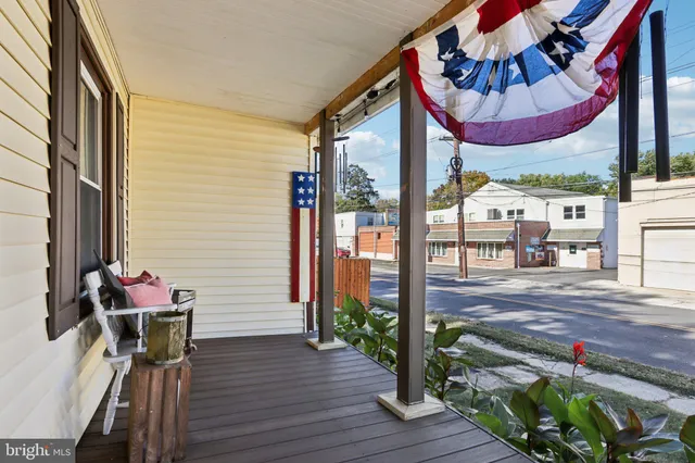 a view of a porch with furniture