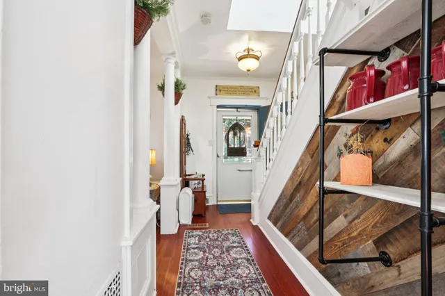 a view of an entryway with wooden floor