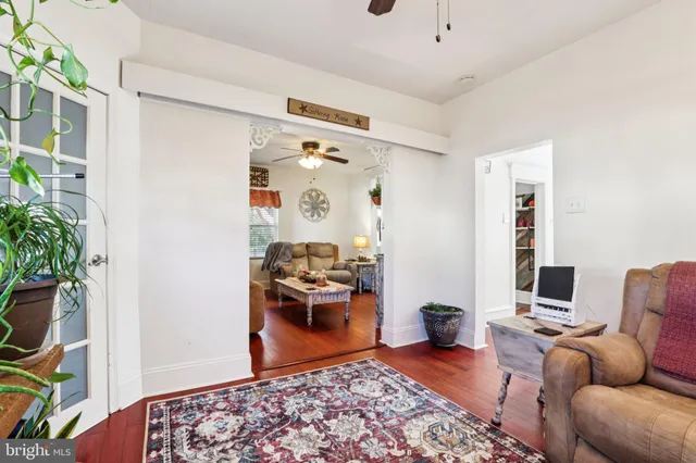 a bedroom with furniture and a rug